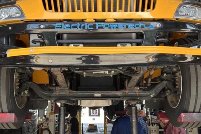 An electric school bus battery seen in the bus’s undercarriage.