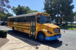 An electric school bus parked on the street