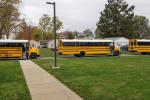 Electric school buses lined up in Williamsfield, Ill. -- credit Tim Farquer