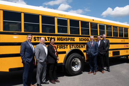 Steelton-Highspire leadership with First Student in front of one of Steelton-Highspire's electric school buses.