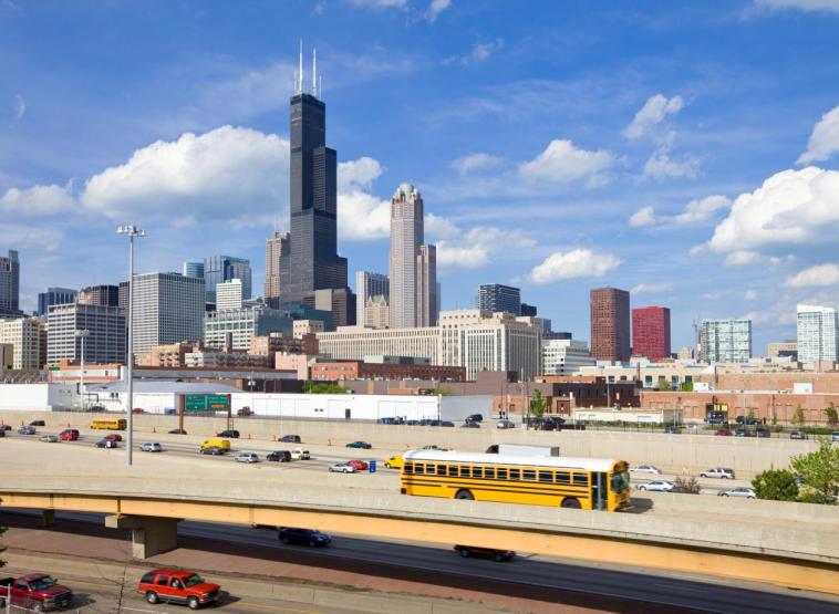 A school bus drives on a Chicago highway. Diesel-powered school buses produce toxic exhaust linked to asthma, cancer and respiratory illnesses. Photo by benedek/iStock