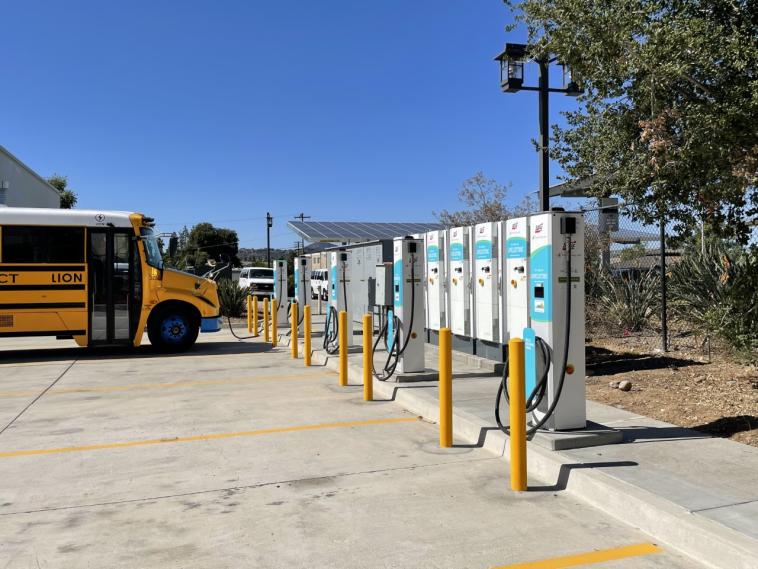 An electric school bus charging at Cajon Valley.