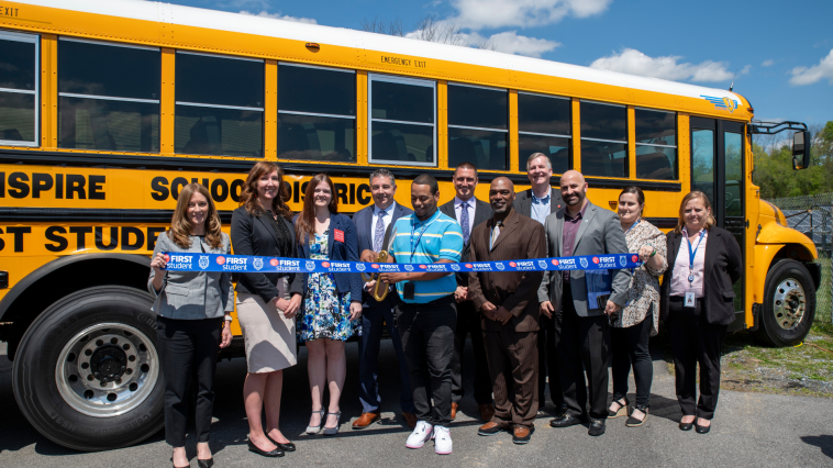  Steelton-Highspire leadership with First Student in front of one of Steelton-Highspire's electric school buses during their ribbon-cutting celebration