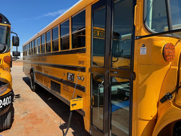 A charging electric school bus